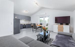 a living room with a couch and a table at Ferienhaus Anton in Peroj