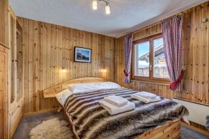 Ένα ή περισσότερα κρεβάτια σε δωμάτιο στο Chalet d'Arbi