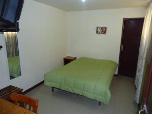 Ένα ή περισσότερα κρεβάτια σε δωμάτιο στο Hotel Estación Central