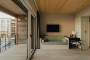 TV a/nebo společenská místnost v ubytování Design Hotel zum Hirschen Salzburg