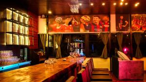 a bar with a wooden counter in a restaurant at Tourist Land Resort - Rani Cottage in Dharān Bāzār