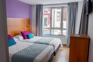 Hotel Faranda Marsol Candas, Ascend Hotel Collection客房内的一张或多张床位