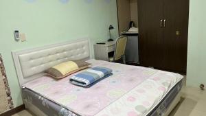 Letto o letti in una camera di 永春棧Kozzy Apartment