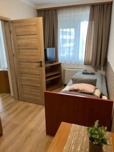 Posteľ alebo postele v izbe v ubytovaní Brookforest Apartman