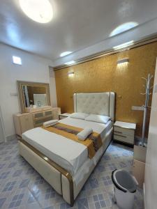 a bedroom with a large bed in a room at Ontrack Travel - room in Male City