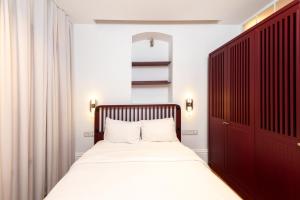a bedroom with a bed and a red cabinet at Liberty Residence in Istanbul
