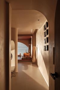 a room with a hallway with a view of the ocean at Sanjian Twilight Diary Seaview Hotel in Dali