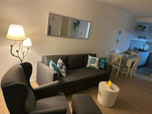 a living room with a couch and a table at MM Apartments Zore in Zagreb