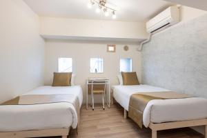 Ένα ή περισσότερα κρεβάτια σε δωμάτιο στο 東新宿 1108