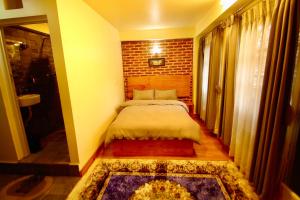 Katil atau katil-katil dalam bilik di Lumwoh Guest House