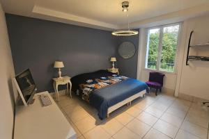 a bedroom with a bed and two tables and a window at Le Pavillon dans le Parc in Saulxures-sur-Moselotte +22 photos