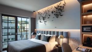 Posteľ alebo postele v izbe v ubytovaní Heritage Hill Hotel