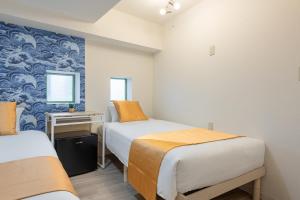 Ένα ή περισσότερα κρεβάτια σε δωμάτιο στο 東新宿1103