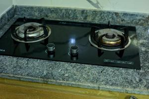 a stove top with two burners on a counter at Builders Homes and Apartments in Ibadan