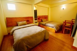 Katil atau katil-katil dalam bilik di Lumwoh Guest House
