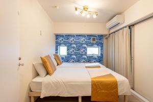 Ένα ή περισσότερα κρεβάτια σε δωμάτιο στο 東新宿 1102