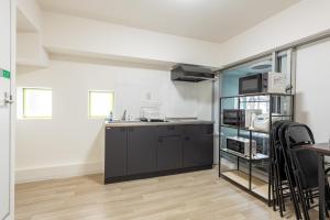 Η κουζίνα ή μικρή κουζίνα στο 東新宿 1102 +36 φωτογραφίες