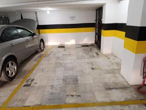 a parking garage with a car parked in it at La Dolce Vita in Chalkida