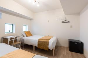 Ένα ή περισσότερα κρεβάτια σε δωμάτιο στο 東新宿 1101