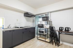 Η κουζίνα ή μικρή κουζίνα στο 東新宿 1101