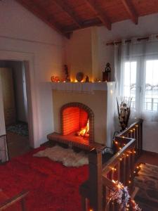 a living room with a fire place in the wall at Lydia in Samos
