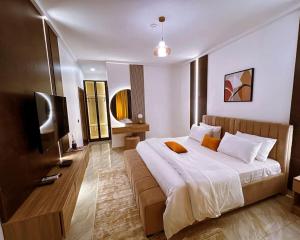 Postel nebo postele na pokoji v ubytování a3 nes luxury apartment