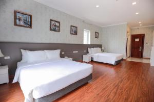 Postel nebo postele na pokoji v ubytování Hotel Du Lys