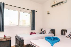 Cama ou camas em um quarto em Elite Residence Dahab