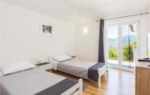 Postel nebo postele na pokoji v ubytování Four-Bedroom Holiday Home In Blato Na Cetini