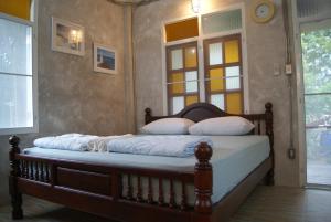 Tempat tidur dalam kamar di Sichang My home