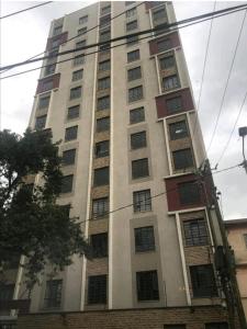a tall white building with many windows at LN EXECUTIVE FURNISHED WEST STUDIOs in Nairobi +12 photos