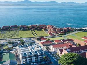 an aerial view of a town next to the ocean at 201 & 210 Mossel Cove in Mossel Bay