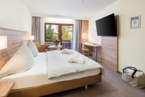 Postel nebo postele na pokoji v ubytování Hotel Waldachtal