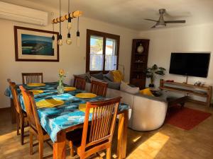 a living room with a table and a couch at Détente au soleil in Sorède