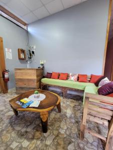 a living room with a couch and a table at D's Inn in San Ignacio