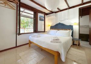 Posteľ alebo postele v izbe v ubytovaní Solemar Sicilia - Seaside House Capo Zafferano
