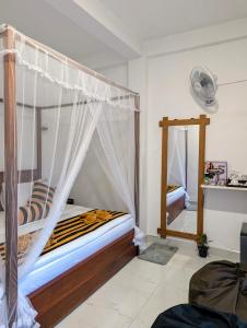 Postel nebo postele na pokoji v ubytování Rich Grove Inn