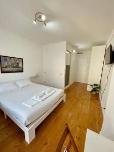 Postel nebo postele na pokoji v ubytování Le stanze di Vallí