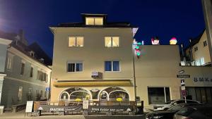 a tall building with a sign in front of it at Feine 2-Zimmer Dachgeschoßwohnung in Klagenfurt