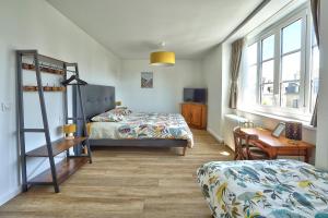 Postel nebo postele na pokoji v ubytování Auberge Ti'gousket