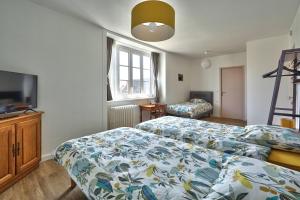 Posteľ alebo postele v izbe v ubytovaní Auberge Ti'gousket