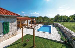 a backyard with a swimming pool and a gazebo at Holiday Home Sicici Iv in Puljane