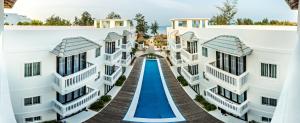 arial view of a building with a slide in the middle at Mary Beach Hotel & Resort in Sihanoukville