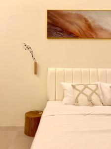 Postel nebo postele na pokoji v ubytování ONE18 Boutique Hotel