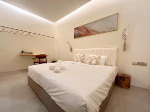 Postel nebo postele na pokoji v ubytování ONE18 Boutique Hotel
