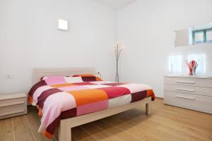 Postel nebo postele na pokoji v ubytování Appartamento Zeller Tione