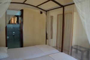 Postel nebo postele na pokoji v ubytování Tandem Guesthouse