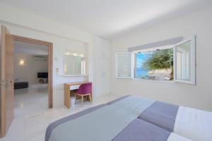 Ένα ή περισσότερα κρεβάτια σε δωμάτιο στο Villa Odysseus +38 φωτογραφίες