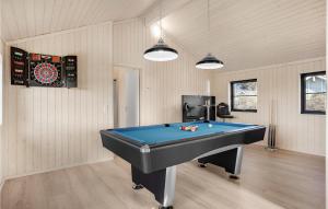 a room with a ping pong table in it at Cozy Home In Ebeltoft With Sauna in Ebeltoft +25 photos