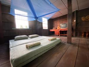 Katil atau katil-katil dalam bilik di Lazy Mango Home Stay